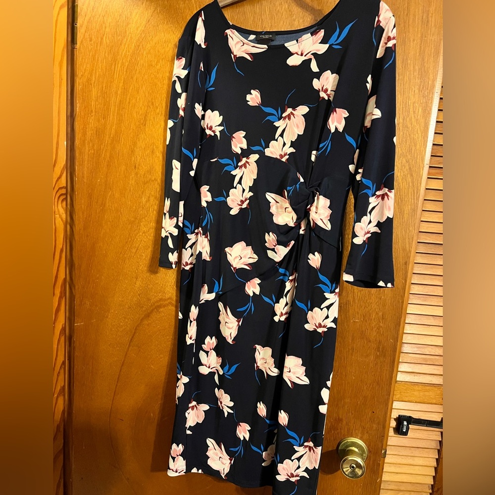 Navy floral, conventional below the knee fit. Perfect office attire, no wrinkles